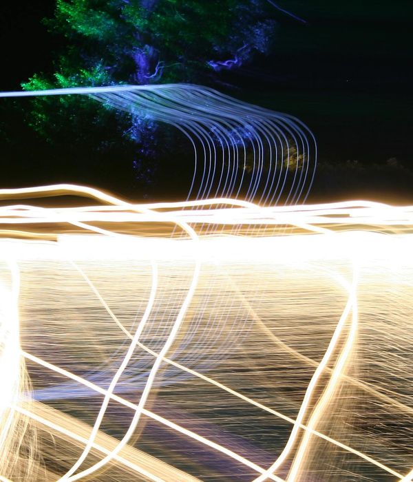 Abstract glowing lines representing body flexibility and energy flow